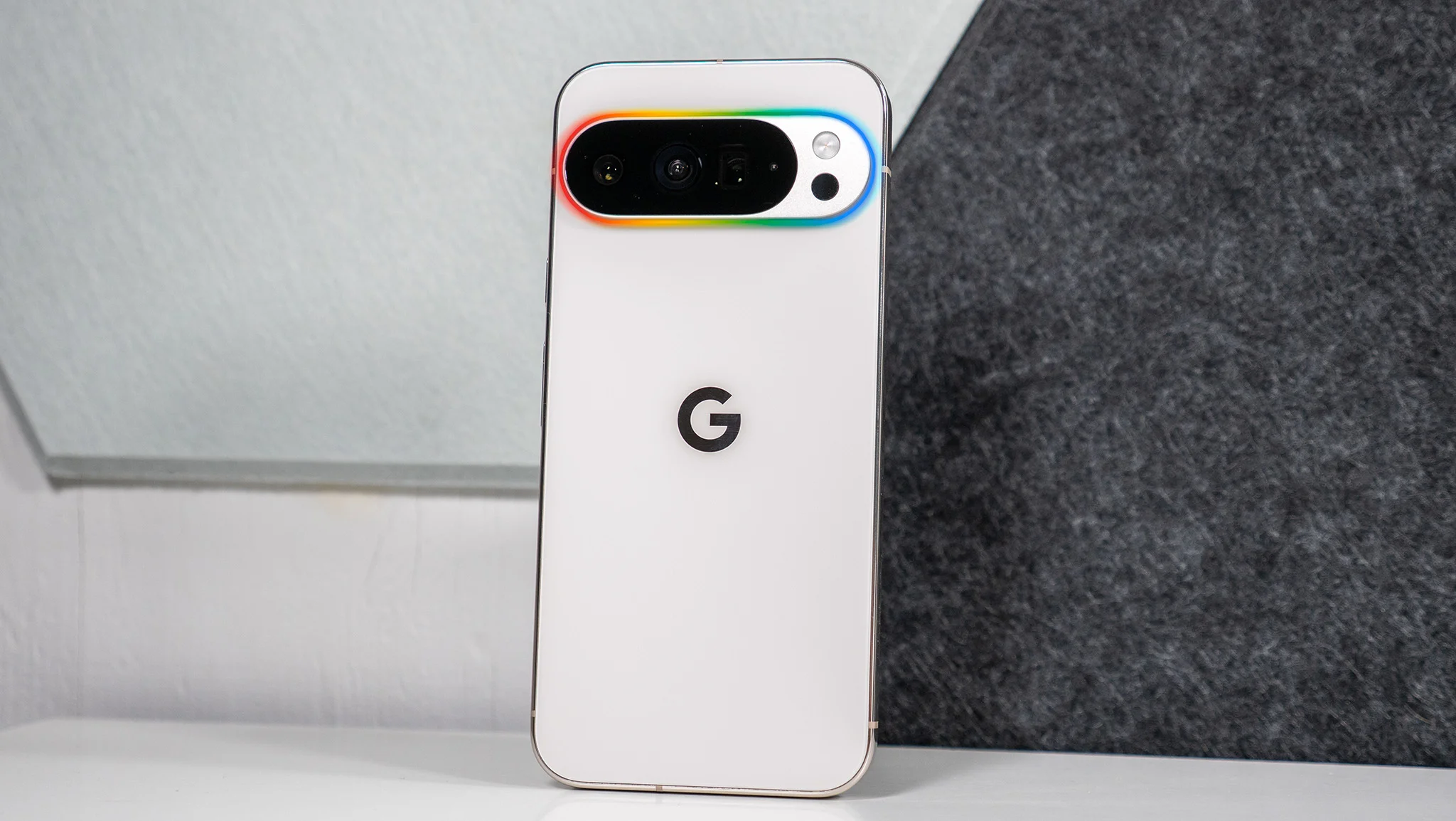 A mockup of a Pixel 11 with a glowing camera island representing the rumored Pixel Glow feature.